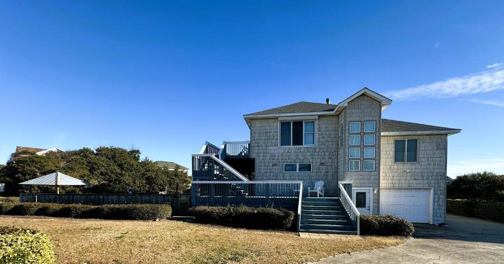 a house with a staircase in front of it at KH101 - Shells in Kitty Hawk