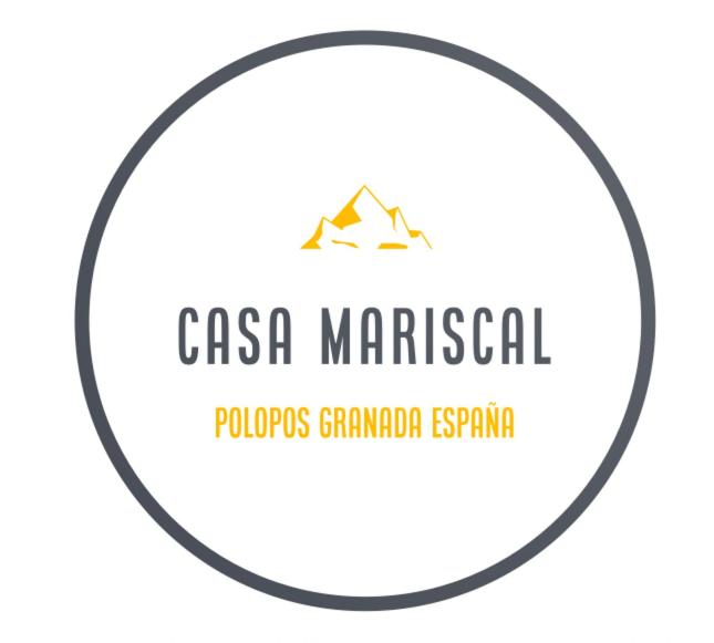 a logo for a company with a mountain in a circle at Casa Mariscal Polopos in Polopos