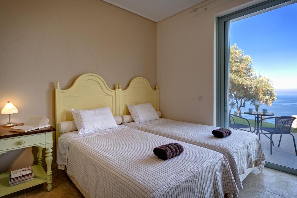 Кровать или кровати в номере Olivia's Villas of Luxury