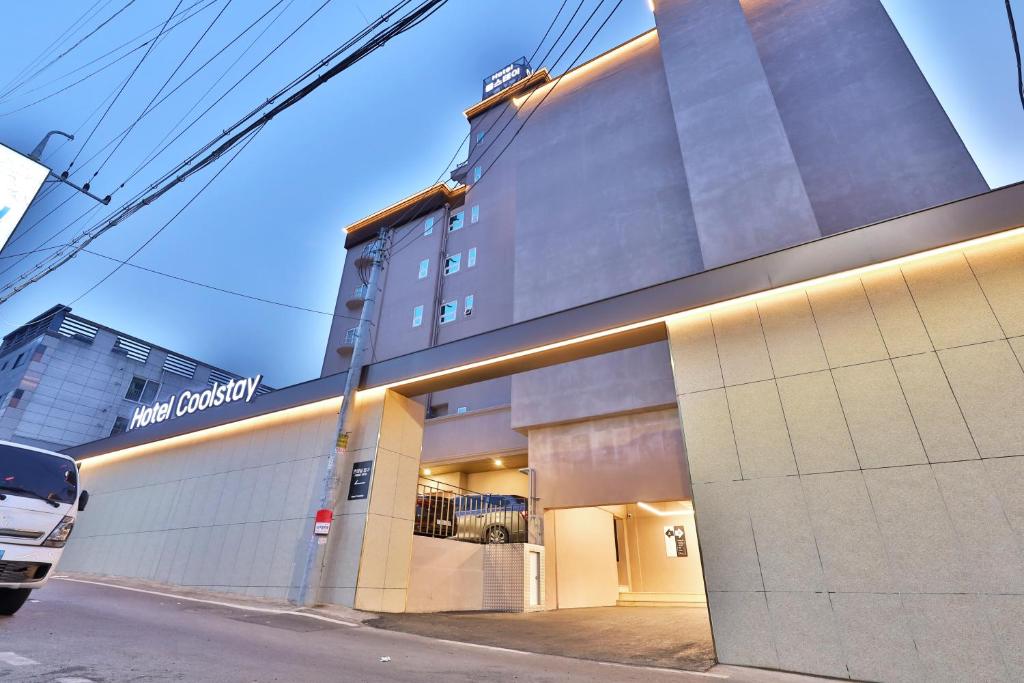 a building with a sign on the side of it at Hotel Coolstay Gimcheon in Gimcheon
