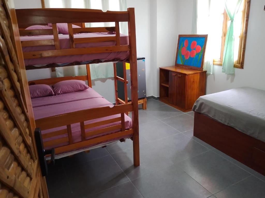 a bedroom with two bunk beds and a bed at Fifi Shouse Ayangue in Santa Elena