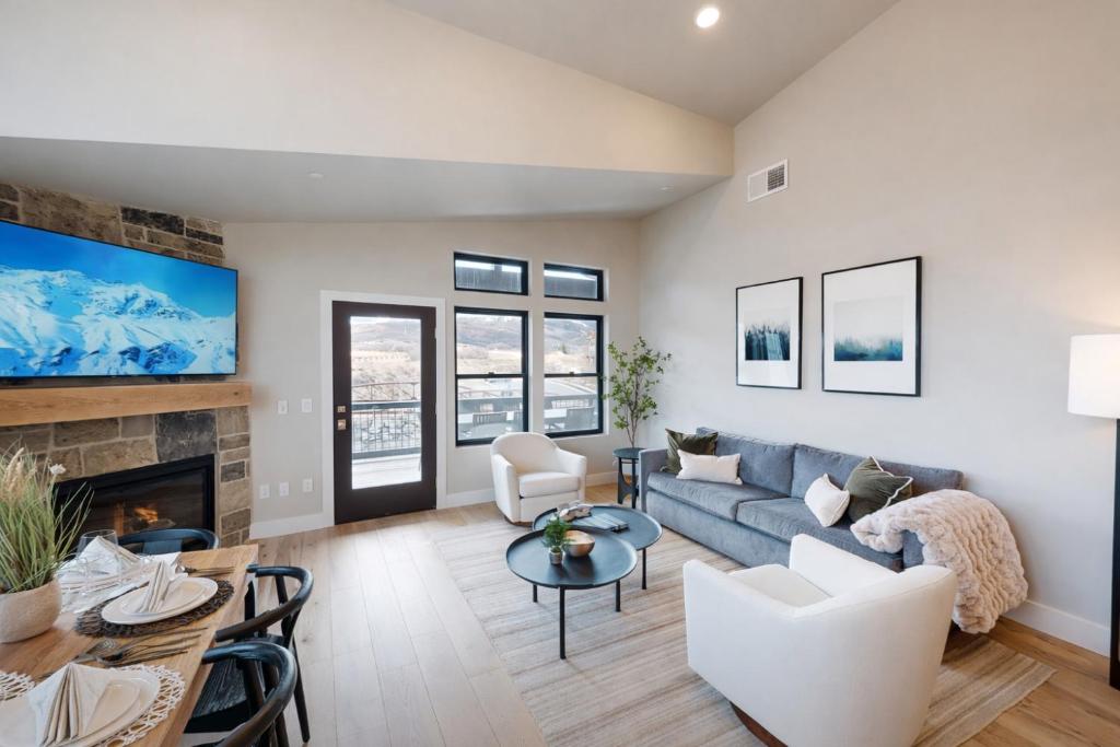 a living room with a couch and a fireplace at Helling Circle Hideaway 303 in Heber City