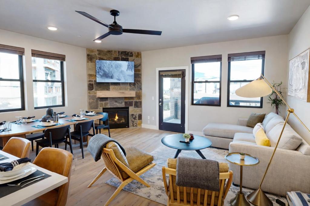 a living room with a couch and tables and a fireplace at Flying Moose at Helling Circle 101 condo in Heber City