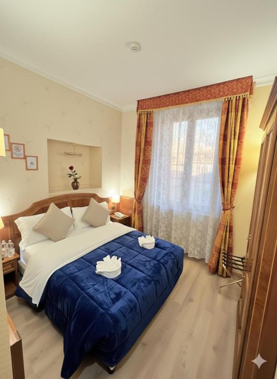 Postel nebo postele na pokoji v ubytování Hotel Amadeus