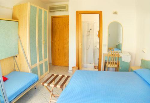 Postel nebo postele na pokoji v ubytování Hotel Vallechiara