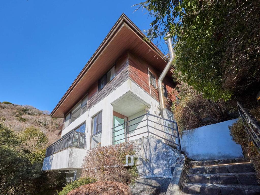 a house with stairs leading up to it at Oyado S in Hakone