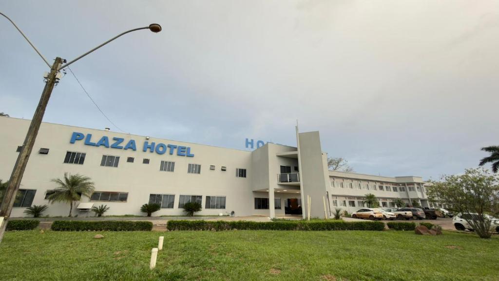 a large white building with a plaza hotel at Plaza Hotel in Mineiros