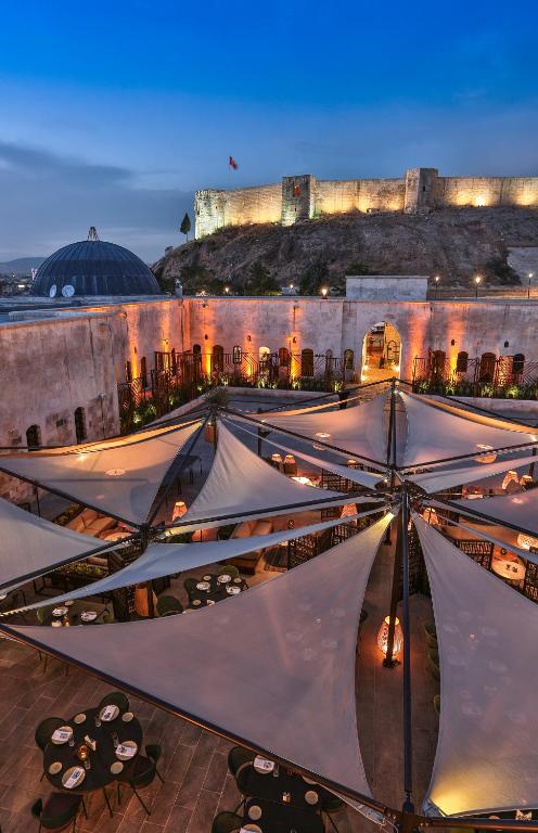 a group of tents in front of a building at HSVHN Hotel Hışvahan in Gaziantep
