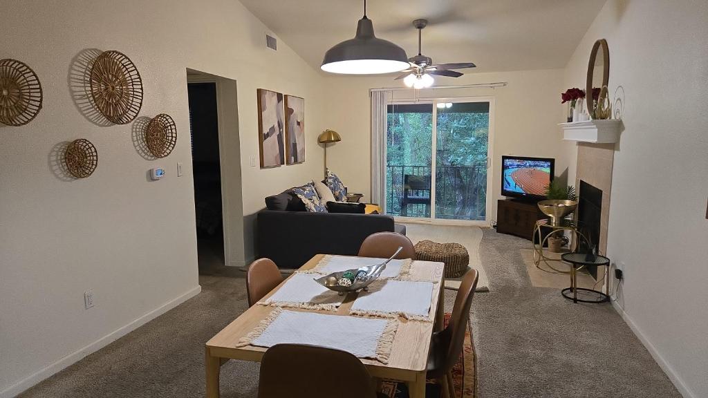 a living room with a table and a couch at Elegant 2Bed & 2 Bath Comfort in Dallas
