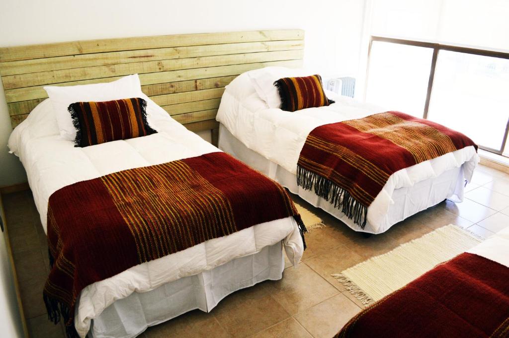 Postel nebo postele na pokoji v ubytování Apart Hotel Endurance