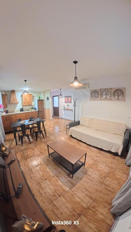 a living room with a couch and a table at El Bosque Nomada 4 in El Bosque