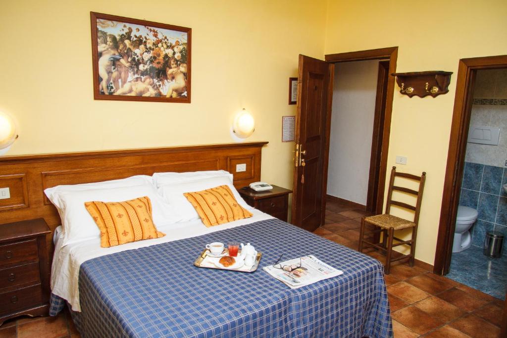 Postel nebo postele na pokoji v ubytování Hotel Nizza