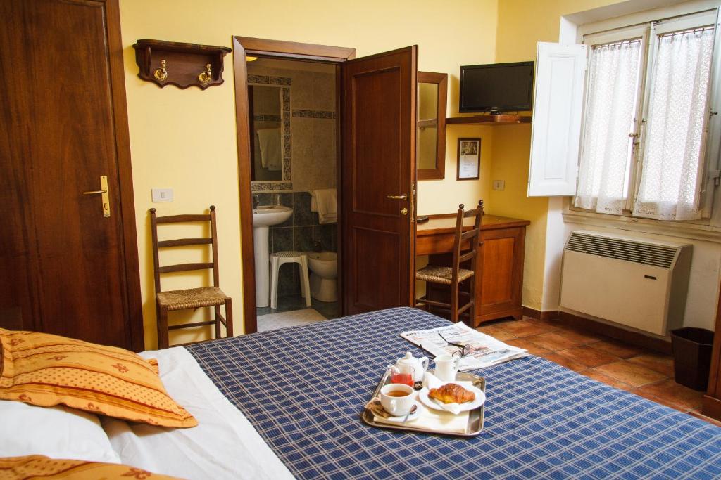 Postel nebo postele na pokoji v ubytování Hotel Nizza