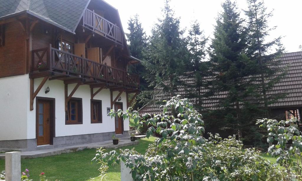 a house with two balconies on the side of it at Apartments Vila Zubović in Kopaonik