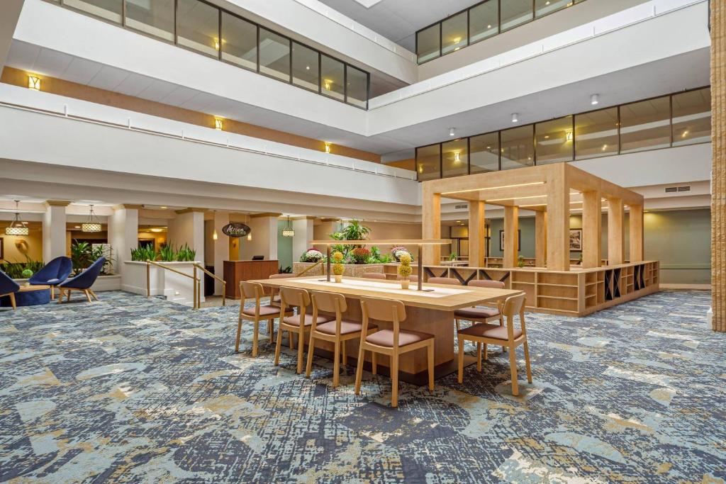 an office lobby with a large table and chairs at Radisson Hotel Philadelphia Northeast in Trevose