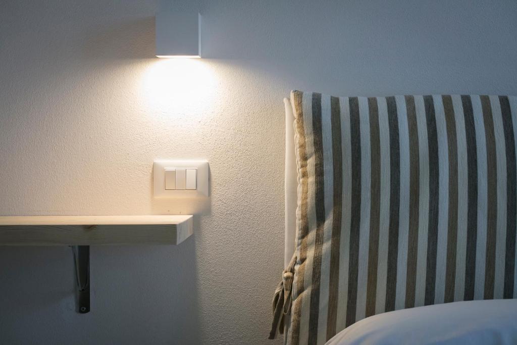 A bed or beds in a room at Affittacamere Margherita