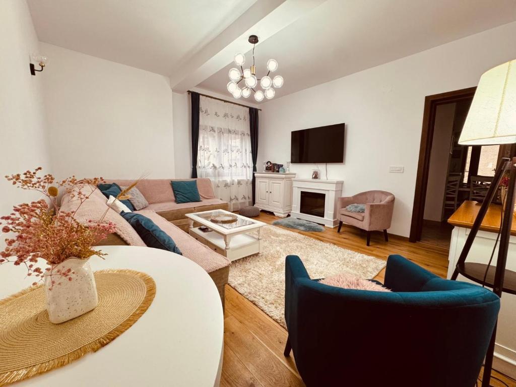 a living room with a couch and a table at Andrei's house in Sinaia