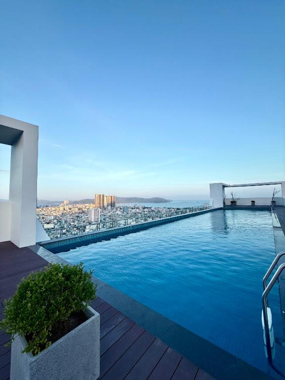 a swimming pool on the roof of a building at Phú Tài Central Life in Quy Nhon