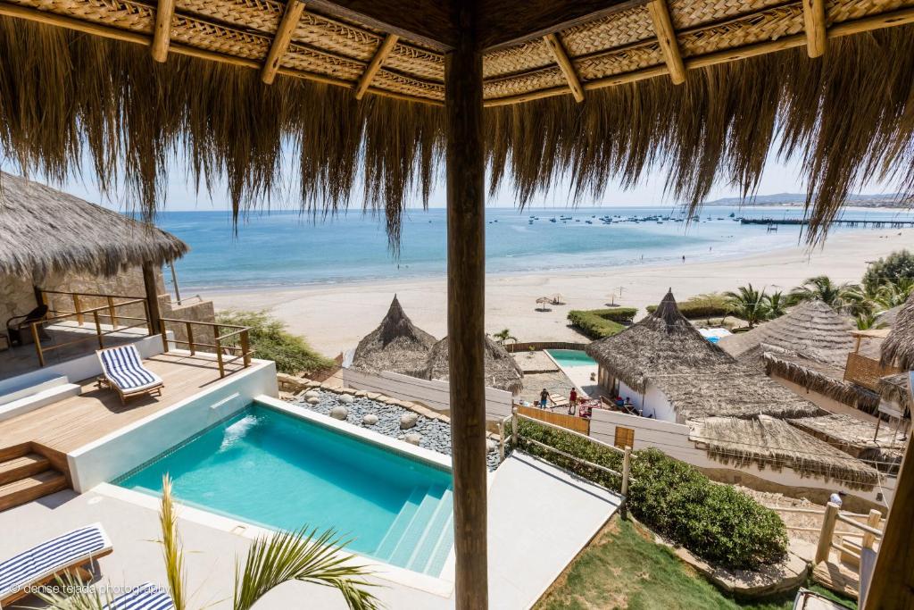 a view of the beach from a resort with a swimming pool at Casa en el Aire in Los Órganos