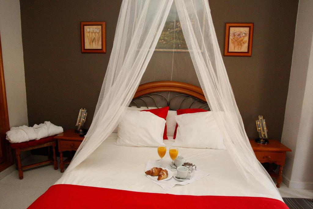 Postel nebo postele na pokoji v ubytování Hotel Argos
