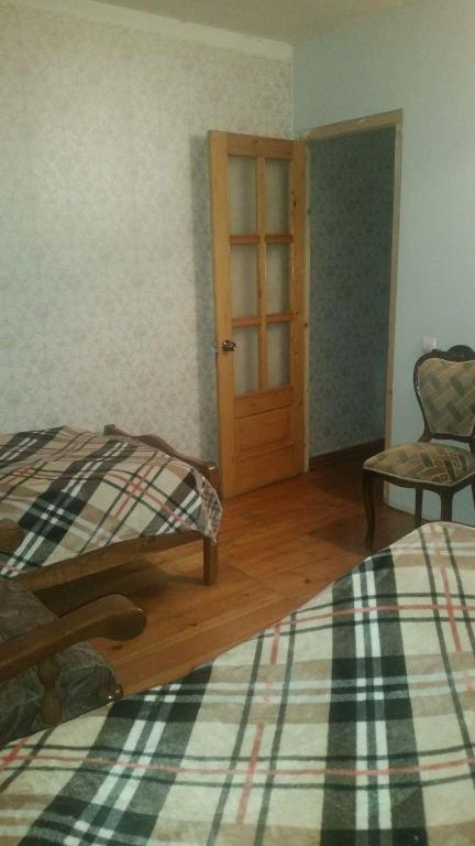 Llit o llits en una habitació de Archil and Nino Gigauri Guest House