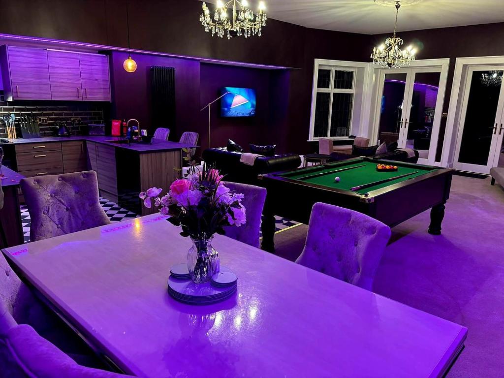 a living room with a pool table and purple lighting at Hamilton Luxury - The James Suite in Scorton