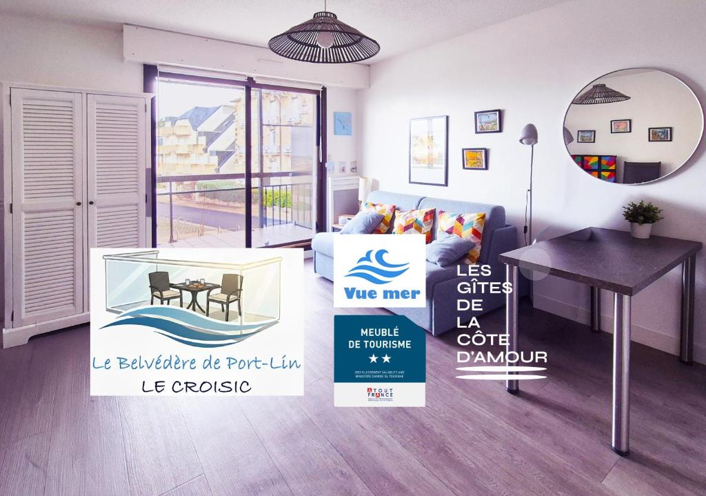 a living room with a table and a couch at Le Belvédère de Port-Lin - Les Gîtes de la Côte d'Amour in Le Croisic
