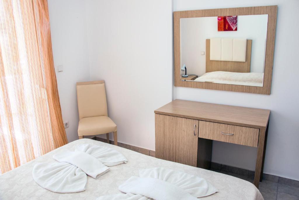 Postel nebo postele na pokoji v ubytování Gennadi Gardens Apartments & Villas