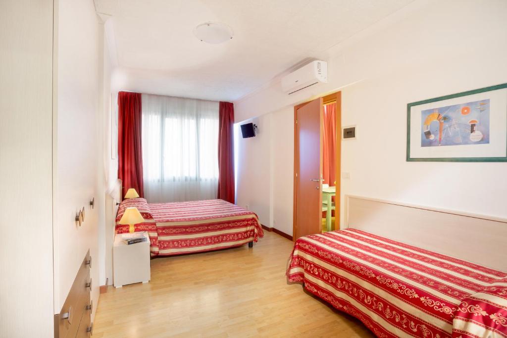 Postel nebo postele na pokoji v ubytování Hotel Palladio