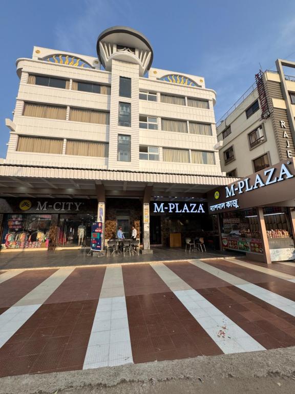 a large building with a street in front of it at Hotel M Plaza New Digha in Digha