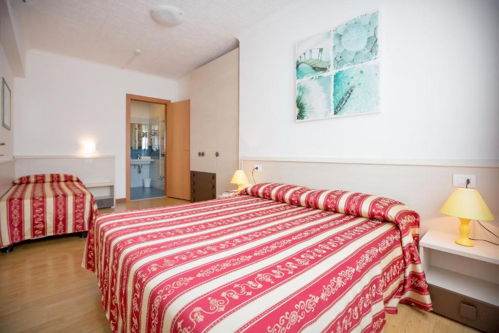Postel nebo postele na pokoji v ubytování Hotel Palladio