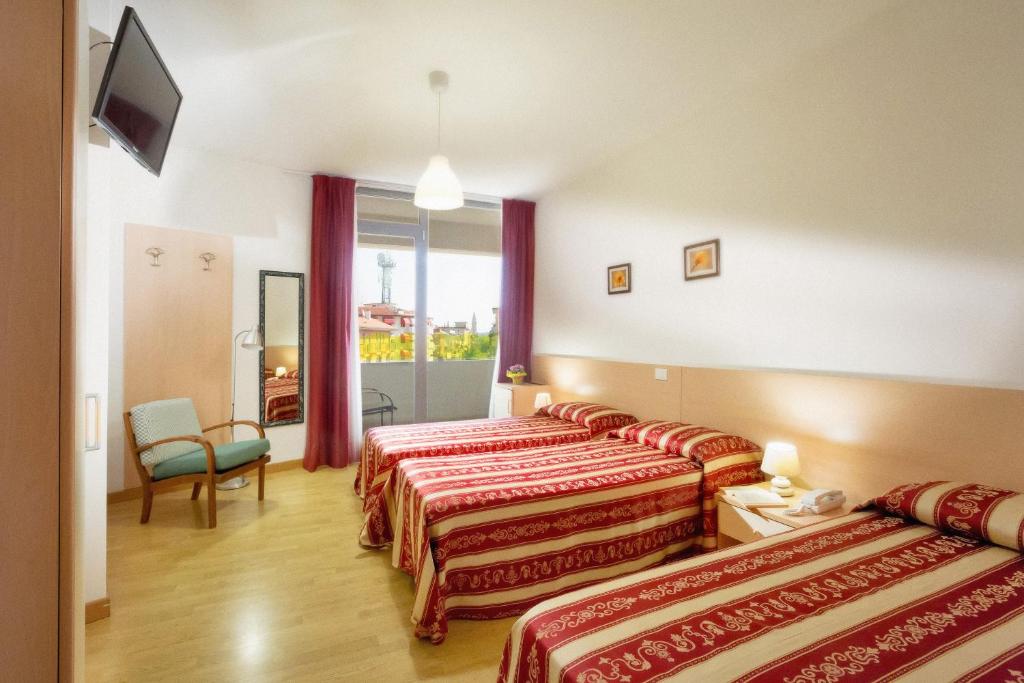Postel nebo postele na pokoji v ubytování Hotel Palladio