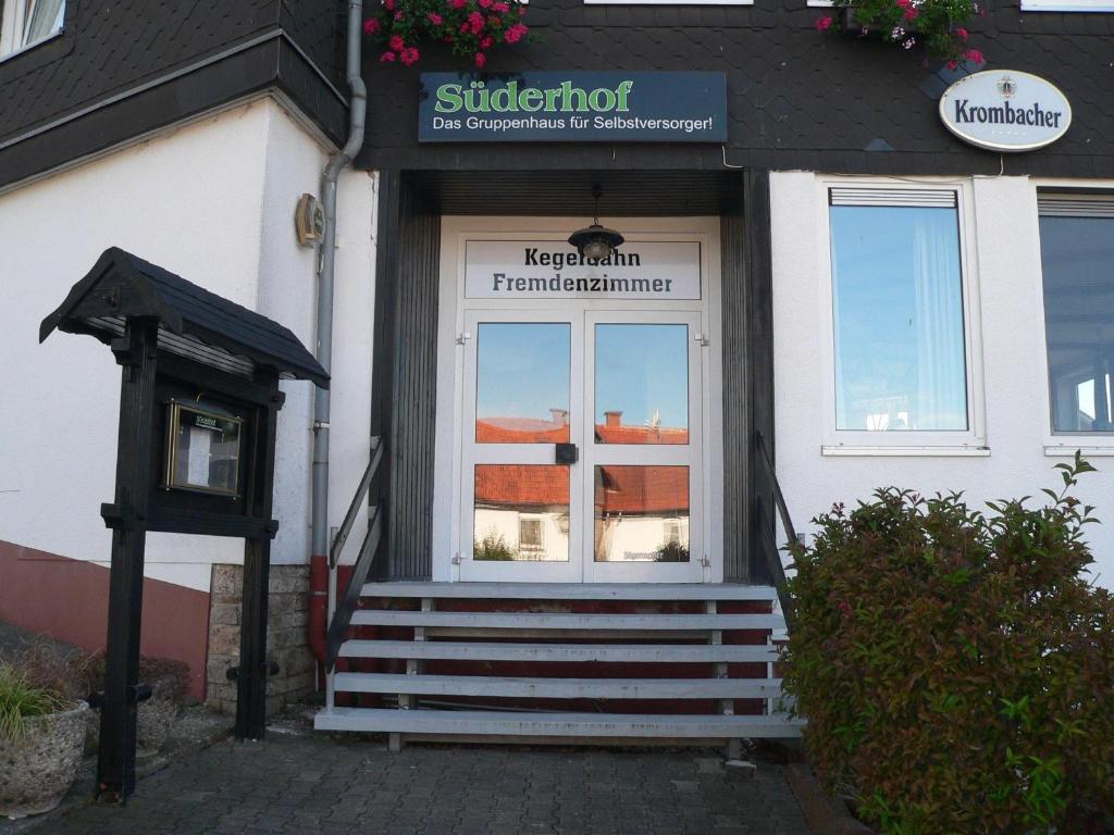 a front door of a building with a sign on it at Suederhof-Diemelsee in Diemelsee