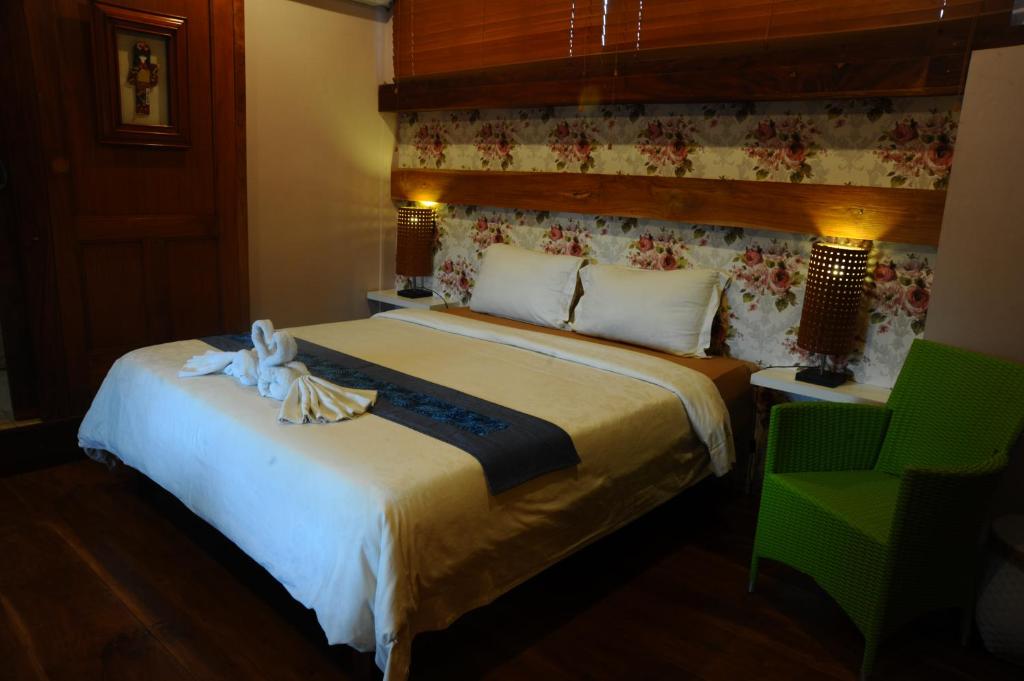 Postel nebo postele na pokoji v ubytování Tegal Panggung Guest House