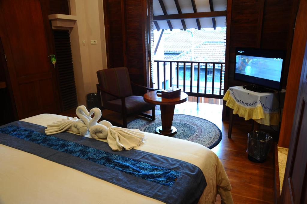 Postel nebo postele na pokoji v ubytování Tegal Panggung Guest House