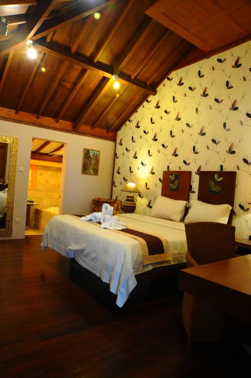 Postel nebo postele na pokoji v ubytování Tegal Panggung Guest House