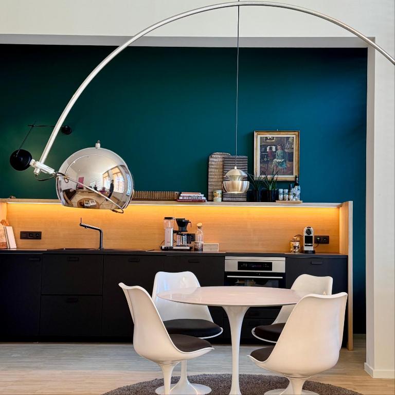 a dining room with a table and chairs at Great to stay Gent I rooms & apartments in Ghent