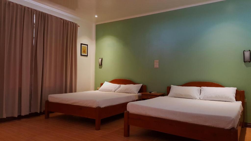Postel nebo postele na pokoji v ubytování Vitton Resort