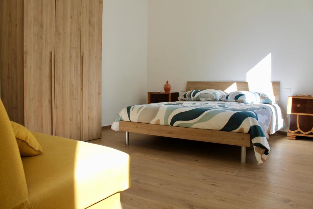 a bedroom with a bed with pillows on it at Seaside Apartments - Central Apartments with View - Molfetta in Molfetta