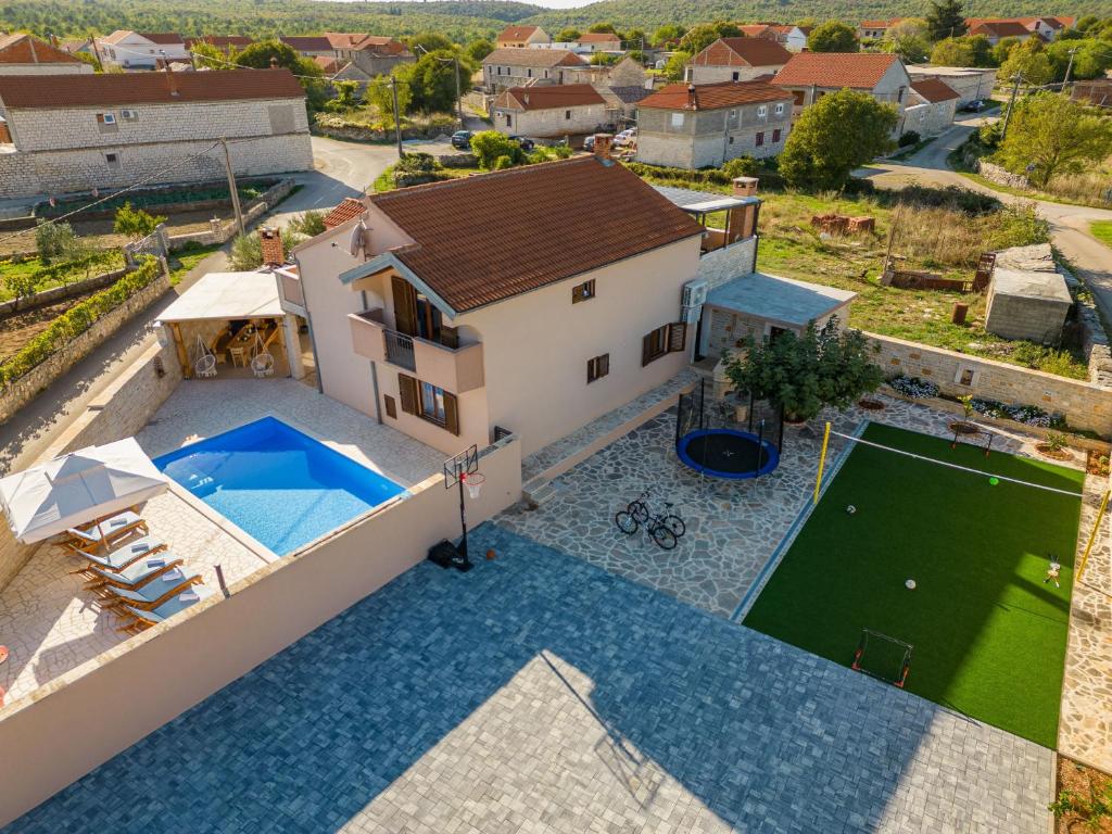 an aerial view of a villa with a swimming pool at Villa Kamen ZadarVillas in Pridraga