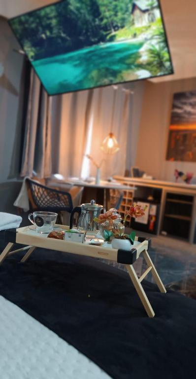 a table with food on it in a living room at GUARULHOS FLAT CENTER - Apart-Hotel in Guarulhos