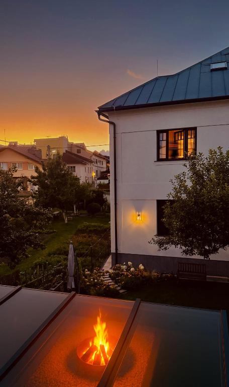 a fire pit in the backyard of a house at Bonton Apartments in Kežmarok