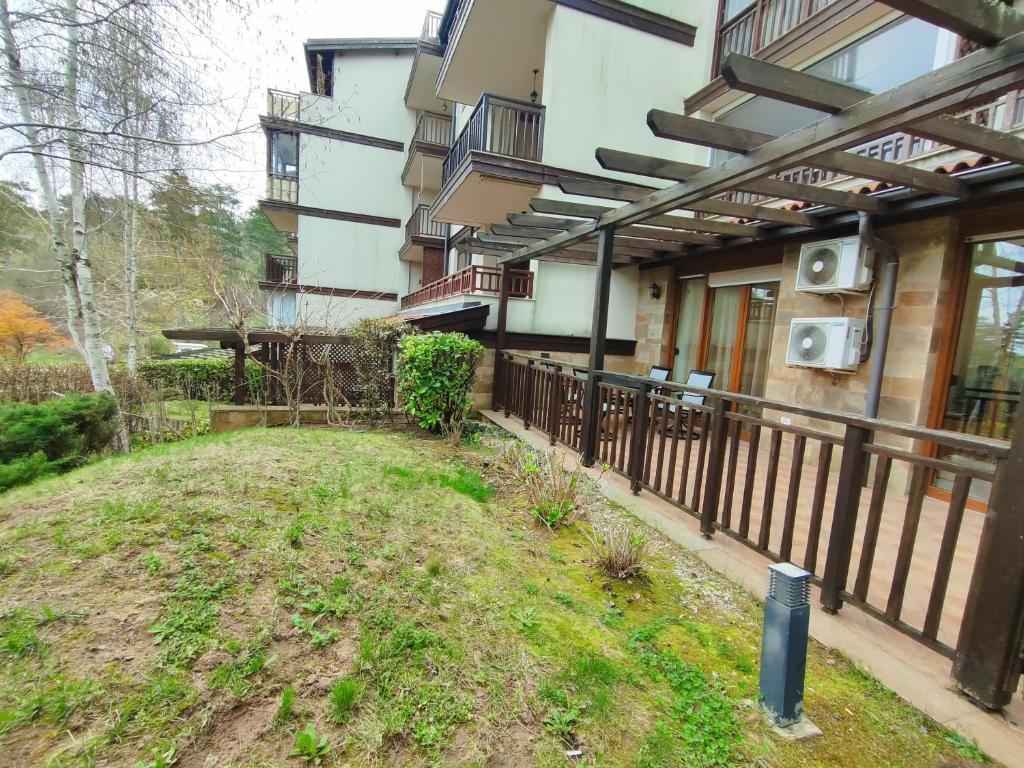 an outside view of a building with a fence at Santa Marina Breeze - One bedroom apartment in Sozopol