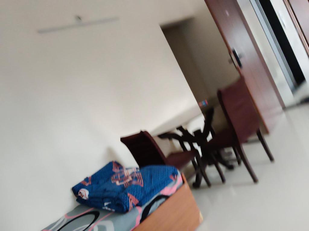 a room with chairs and a box with a bag at Punawale tathwade 1bhk in Méribel Village