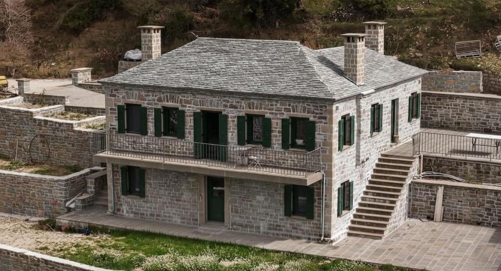 an aerial view of a brick house at Waterfall Kataraktis Vatatsi in Vatátsion