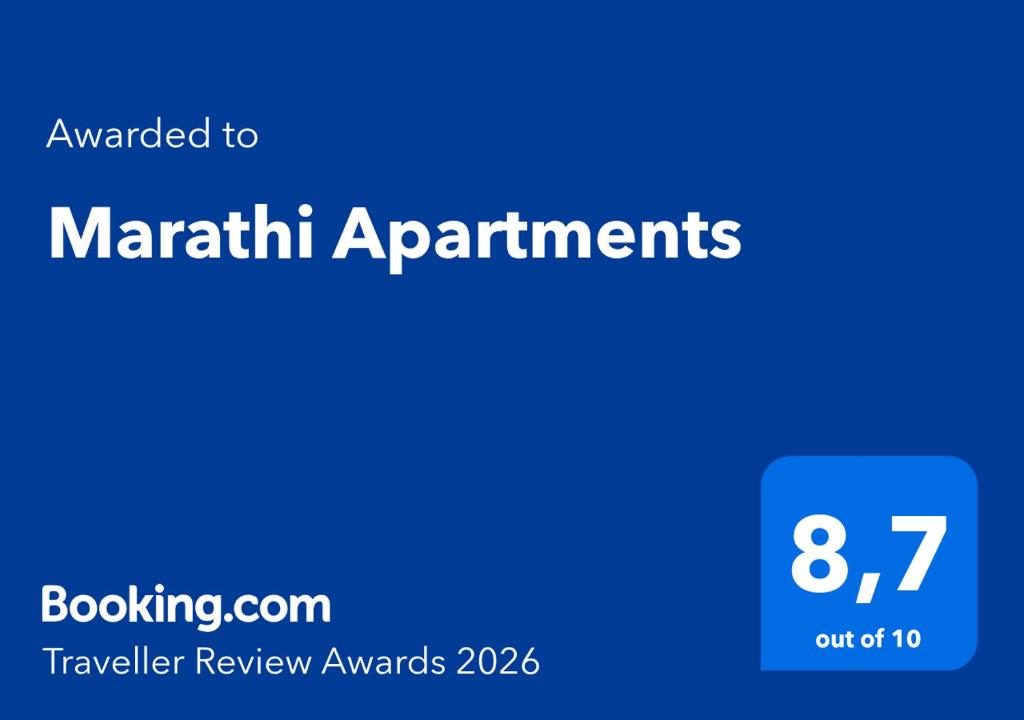 a blue sign with the words march affirmments on it at Marathi Apartments in Maráthion
