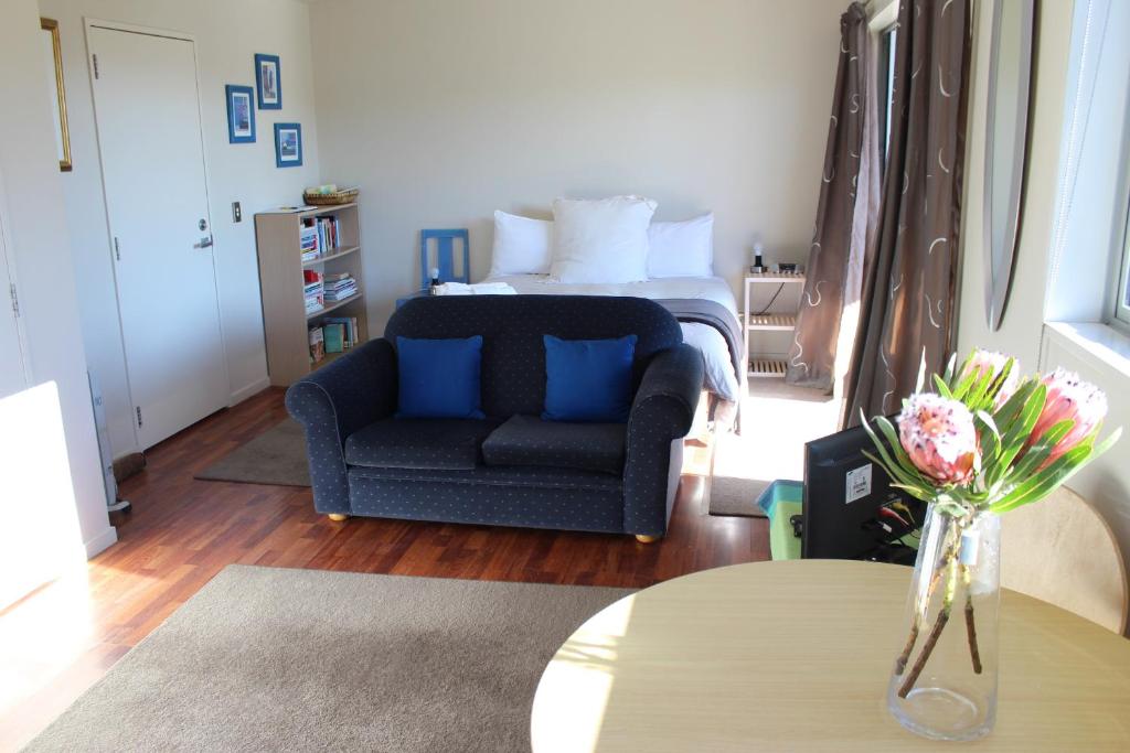 a living room with a couch and a bed at D'Archiac Studio in Lake Tekapo