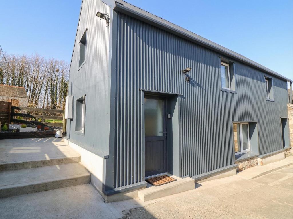a black and white building with a door at The Loft in Kilkenny