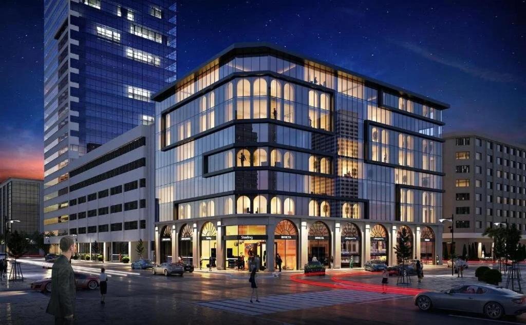 a large glass building with people in front of it at Myway Deluxe Hotel in Konak