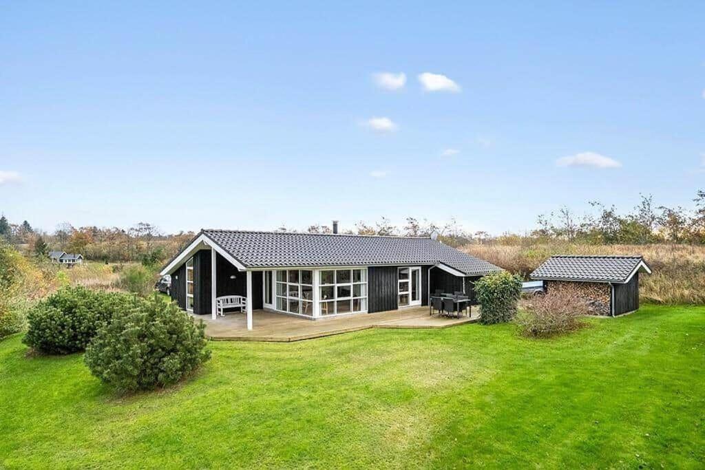 a home with a large yard with a house at JB406-Fjerritslev-Aspevej-68 in Fjerritslev